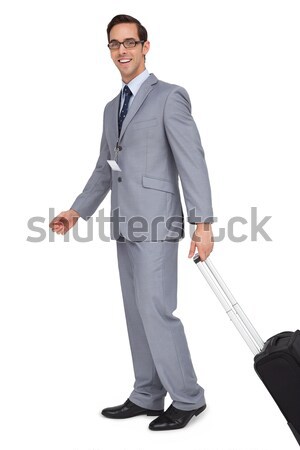 Portrait of a businessman with a suitcase against white babckground Stock photo © wavebreak_media