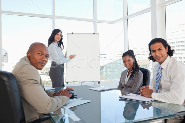 Serious business team almost smiling during a presentation in a meeting room Stock photo © wavebreak_media