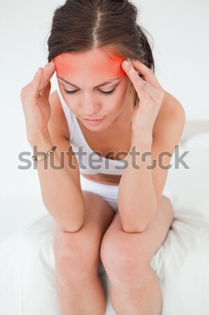 Sério mulher cama brilhante quarto mão Foto stock © wavebreak_media