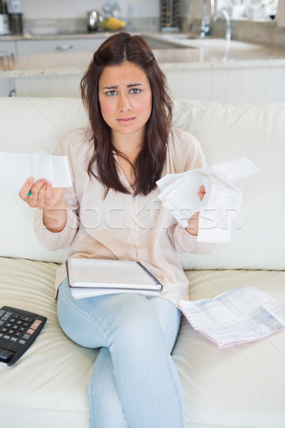 Worried woman calculating finances on sofa Stock photo © wavebreak_media