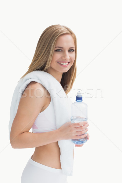 Portrait of smiling young woman with towel around neck holding w Stock photo © wavebreak_media