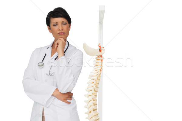 Thoughtful female doctor with skeleton model Stock photo © wavebreak_media