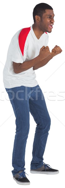 Stock photo: Excited handsome football fan cheering