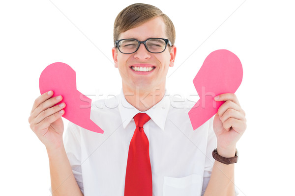 Geeky hipster holding a broken heart card Stock photo © wavebreak_media