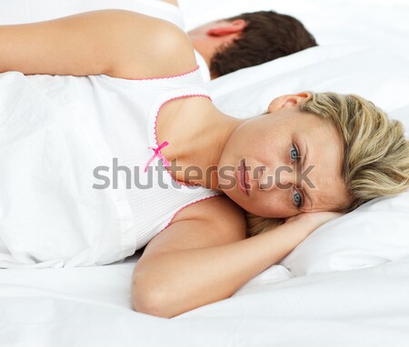Beautiful brunette lying on bed sleeping Stock photo © wavebreak_media