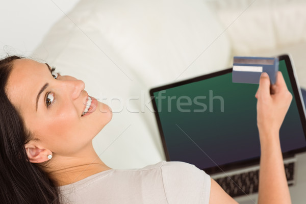 Kadın dizüstü bilgisayar kullanıyorsanız kart beyaz bilgisayar mutlu Stok fotoğraf © wavebreak_media