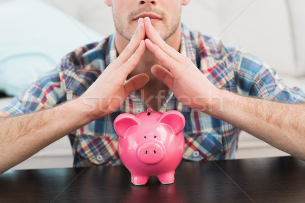 Férfi persely otthon nappali kezek pénzügy Stock fotó © wavebreak_media