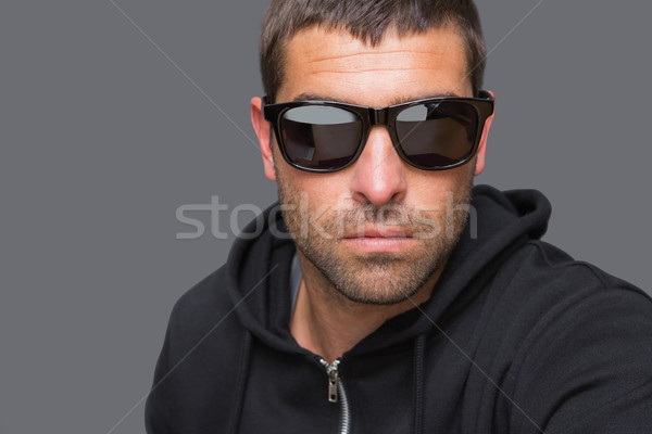 Criminal with sunglasses looking at camera  Stock photo © wavebreak_media