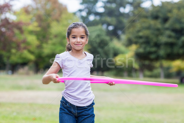 happy girl playing with hula hoops Stock photo © wavebreak_media