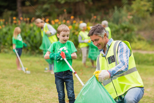 Happy family collecting rubbish  Stock photo © wavebreak_media