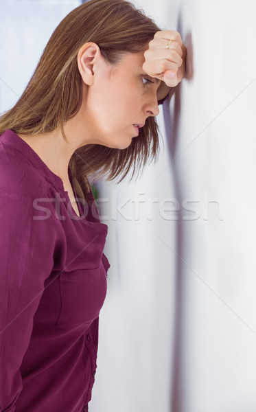 Depressed woman leaning her head against a wall Stock photo © wavebreak_media