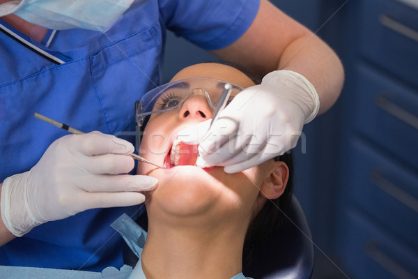 Fogorvos megvizsgál beteg szög tükör fogászati Stock fotó © wavebreak_media