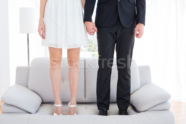 Couple standing on the couch  Stock photo © wavebreak_media