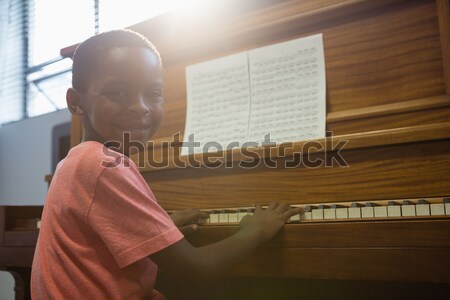Rear view of boy practising piano in classroom Stock photo © wavebreak_media