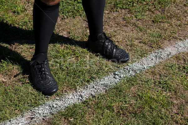 Low section of rugby player standing by yard line on field Stock photo © wavebreak_media