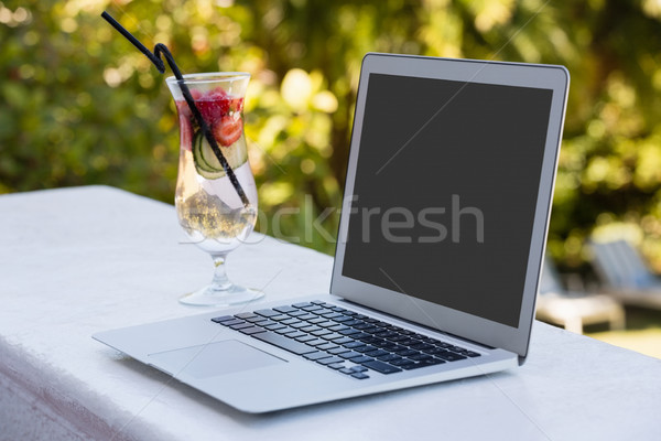 Stock photo: High angle view of laptop and cocktail drink at restaurant