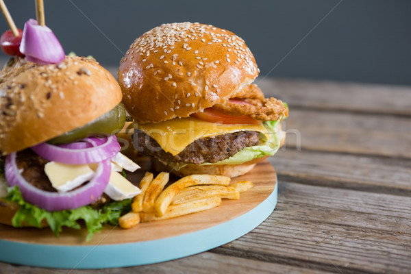 Stock photo: Close up of burgers with french fries