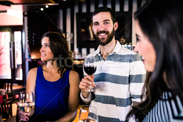 Friends having a glass of wine Stock photo © wavebreak_media