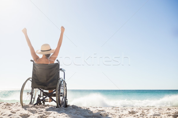 Wheelchair woman sitting  with arms up  Stock photo © wavebreak_media