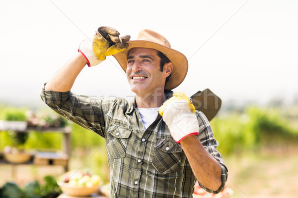 Farmer carrying shovel Stock photo © wavebreak_media