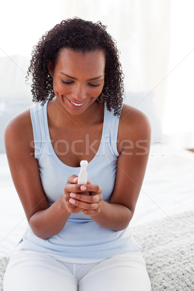 Excited woman finding out results of a pregnancy test  Stock photo © wavebreak_media