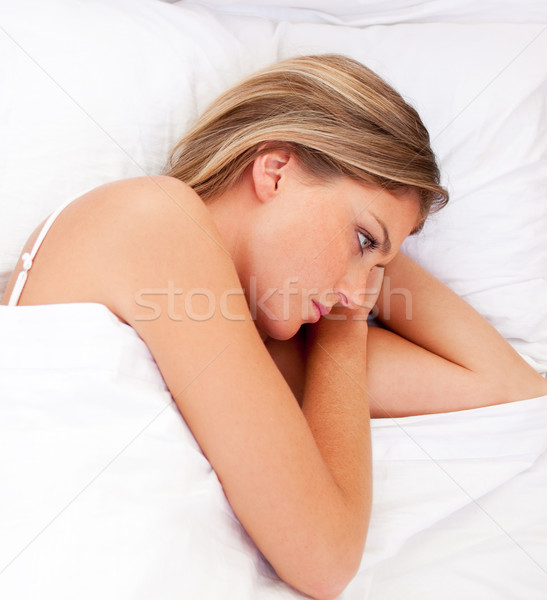 Portrait of a sad woman lying in bed Stock photo © wavebreak_media