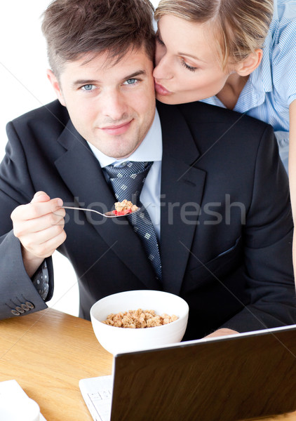 улыбаясь бизнесмен еды завтрак используя ноутбук жена Сток-фото © wavebreak_media
