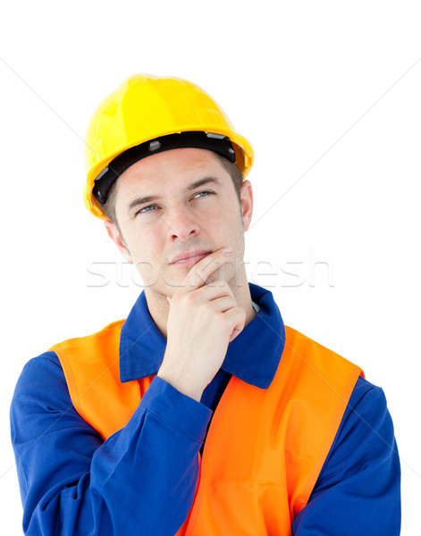 Pensive male worker wearing helmet against white background Stock photo © wavebreak_media
