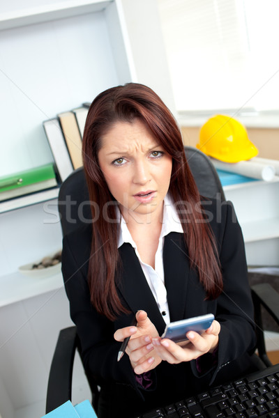 Stockfoto: Ongelukkig · zakenvrouw · naar · camera · calculator