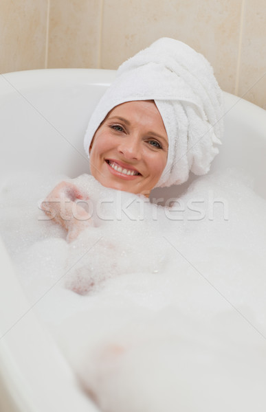 Lovely woman taking a bath with a towel on her head  Stock photo © wavebreak_media