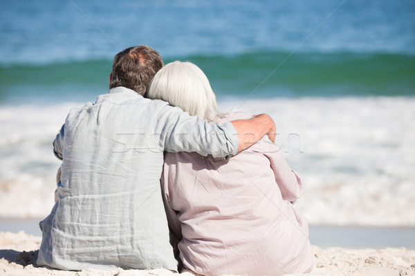 Senior couple sitting on the beach Stock photo © wavebreak_media