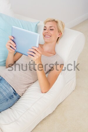 Young attractive female doing yoga in the living room in her appartement Stock photo © wavebreak_media