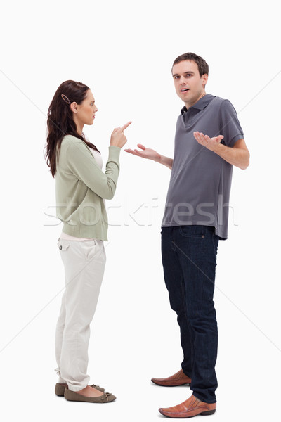 Man shrugged his shoulders is scolded by woman against white background Stock photo © wavebreak_media