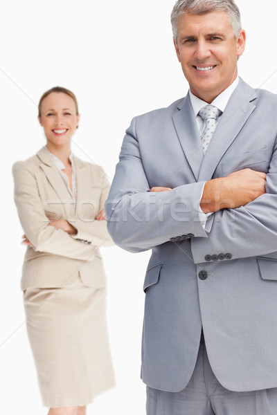 Cheerful business people with folded arms against white background Stock photo © wavebreak_media
