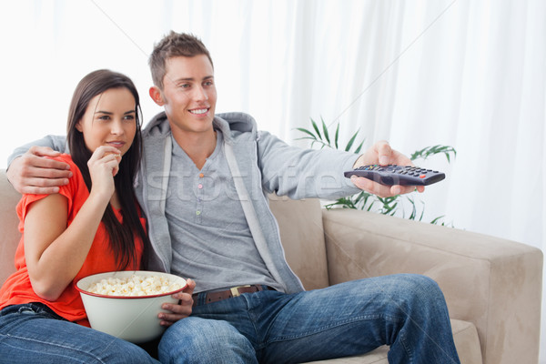 Vue de côté coup souriant couple tv [[stock_photo]] © wavebreak_media