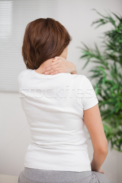 Woman touching her painful nape in a room Stock photo © wavebreak_media