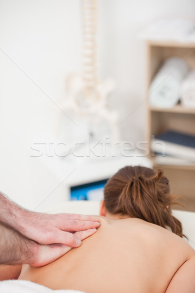 Back of the woman being massaged by a masseur in a room Stock photo © wavebreak_media