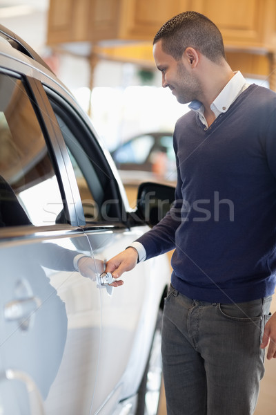 Man holding a car handle in a garage Stock photo © wavebreak_media