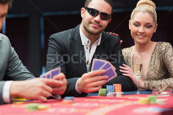Pár póker asztal kaszinó kéz pezsgő Stock fotó © wavebreak_media