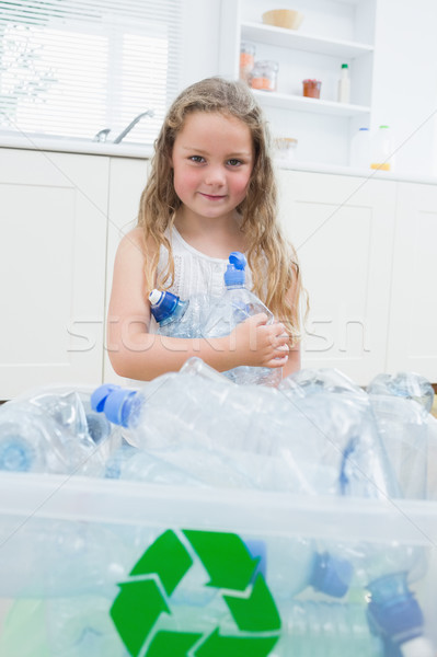 Girl sitting by boxes with plastic on the floor Stock photo © wavebreak_media