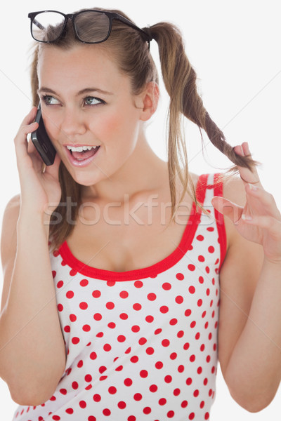 Jeune femme appel jouer cheveux téléphone portable blanche [[stock_photo]] © wavebreak_media