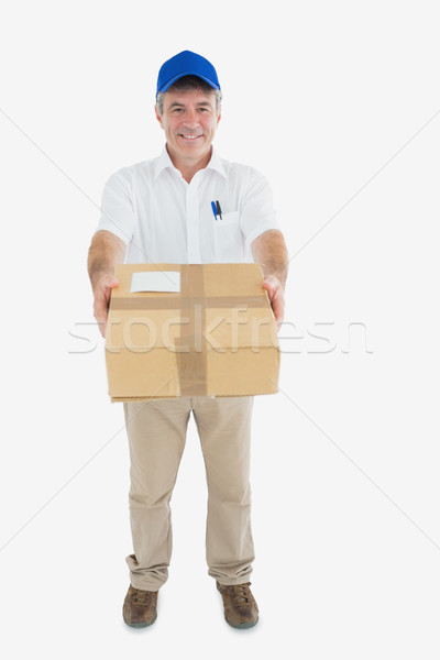 Mature delivery man handing package Stock photo © wavebreak_media