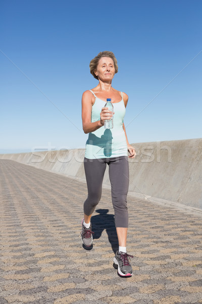 Attivo senior donna jogging pier Foto d'archivio © wavebreak_media