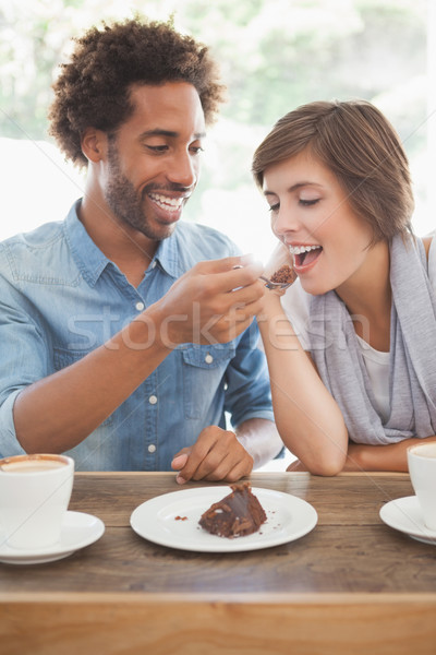 Casual couple having coffee and cake together Stock photo © wavebreak_media