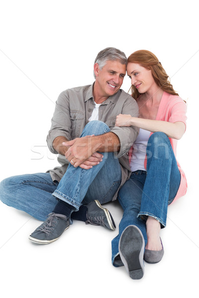 Casual couple sitting and smiling Stock photo © wavebreak_media