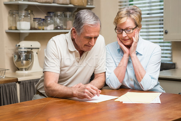 Senior couple working out their bills Stock photo © wavebreak_media