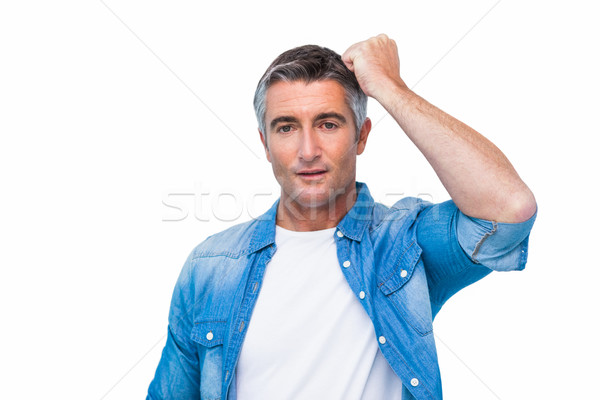 Doubtful man with his fist on head Stock photo © wavebreak_media