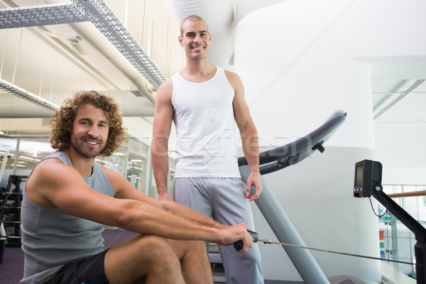 Homme entraîneur homme fitness machine gymnase [[stock_photo]] © wavebreak_media