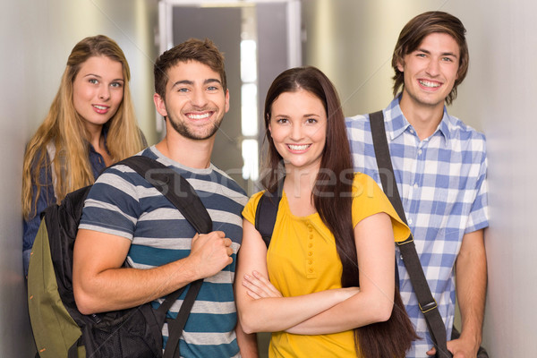 Happy students at college corridor Stock photo © wavebreak_media