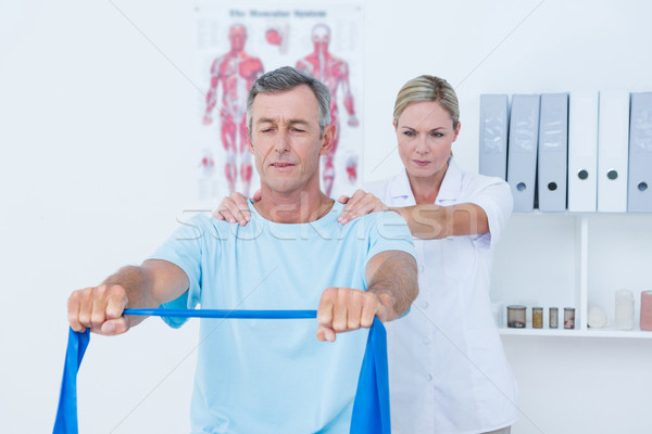 Stock photo: Doctor examining her patient back 